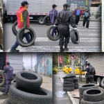 Funcionarios de la alcaldía recolectando llantas abandonadas en el espacio público